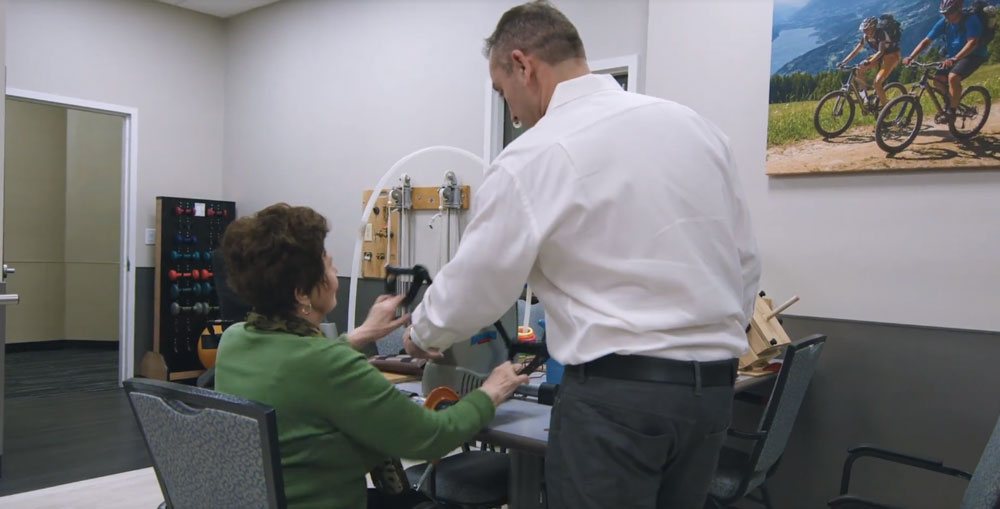 Elderly stroke patient at day care center for seniors to recover faster.