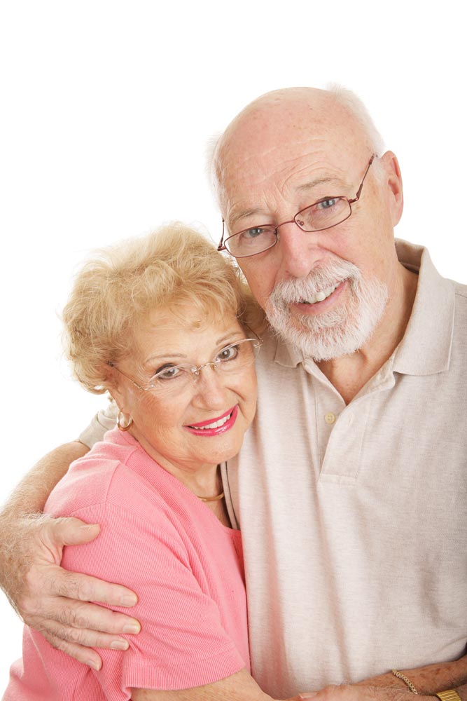 Happy elderly couple shot on a white background