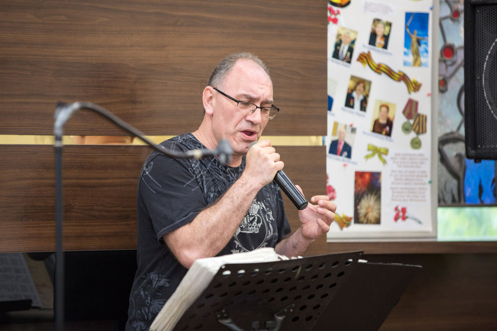 Artist performing live music at Fairview Adult Day Care Center