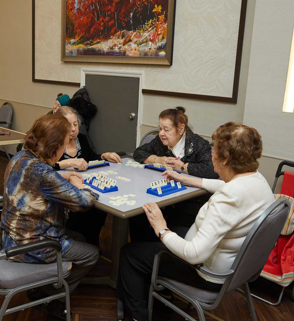 A group of elderly women getting doing rehab activities at our facility