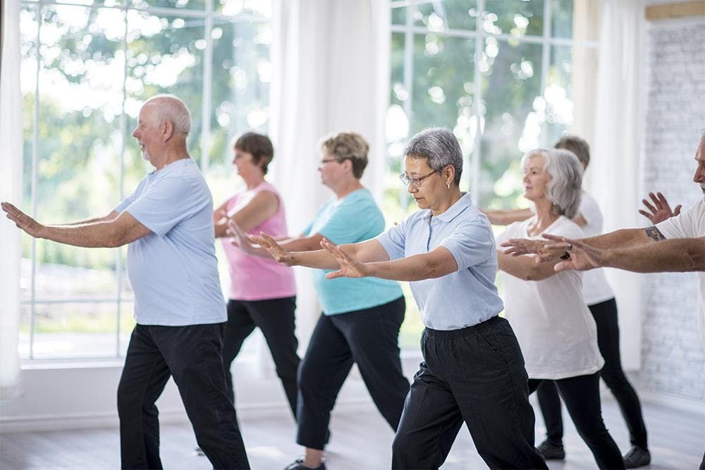 Elderly people exercising to boost their immune system and prevent osteoporosis