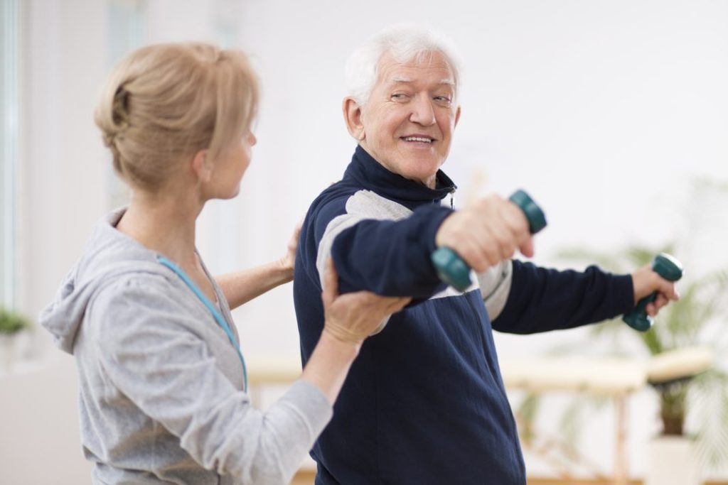 Elderly man doing exercise to avoid chronic health issues