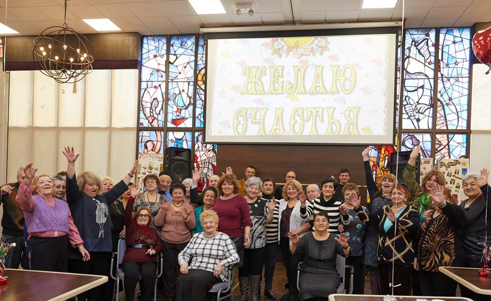 Residents of Fairview ADC sitting together for a group photo during reaction activities session to avoid anxiety