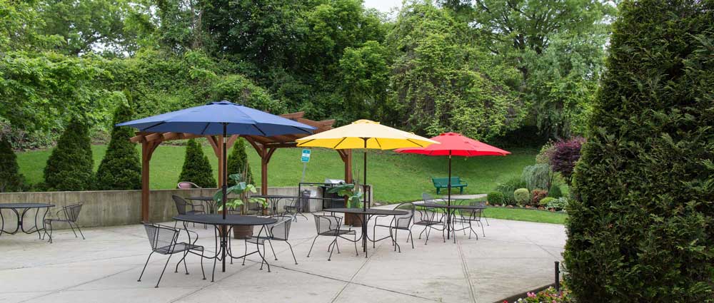 Garden for elderly with umbrellas to avoid hot weather